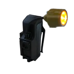 Orange warning beacon attached to a black industrial device, lit up with an amber glow